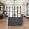 Community kitchen with a lot of space for entertaining and a long island with stools.