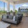 Covered outside patio with ample seating overlooking the pool.